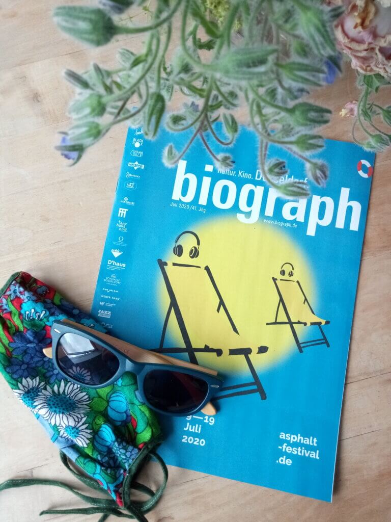 Biograph Magazine cover, colourful face mask, and flowers
