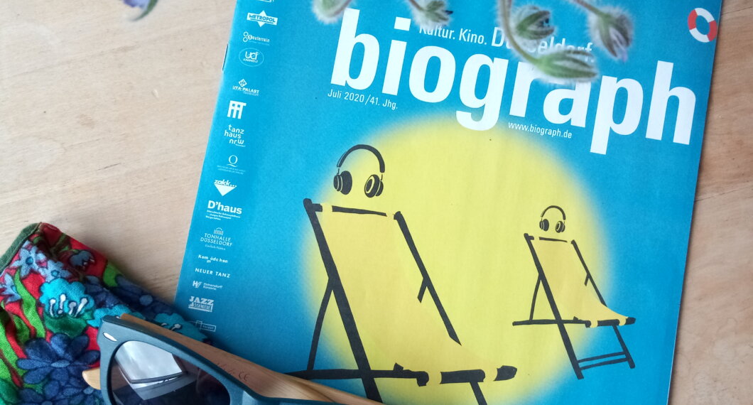 Biograph Magazine cover, colourful face mask, and flowers
