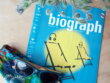 Biograph Magazine cover, colourful face mask, and flowers
