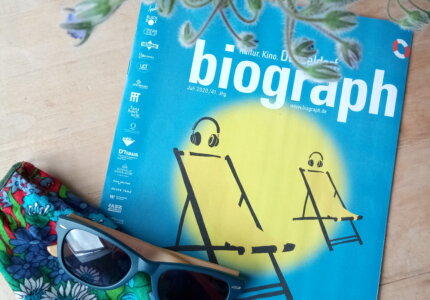 Biograph Magazine cover, colourful face mask, and flowers