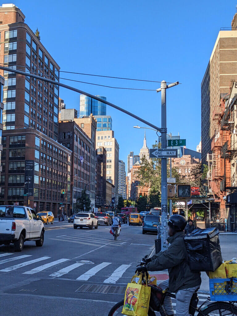 Manhattan delivery bike at a zebra crossing