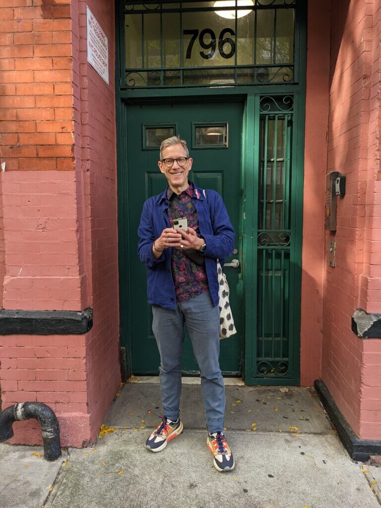 Orange wall, green door