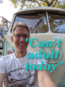 Can't adult today t-shirt motto on a man, Ingo Steinke, smiling in front of an old campervan